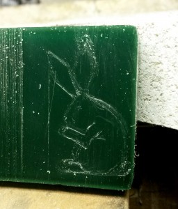 wax carving a rabbit pendant