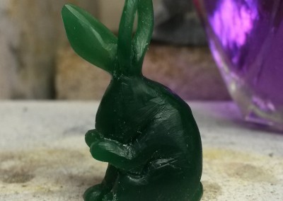 carving a rabbit pendant in wax