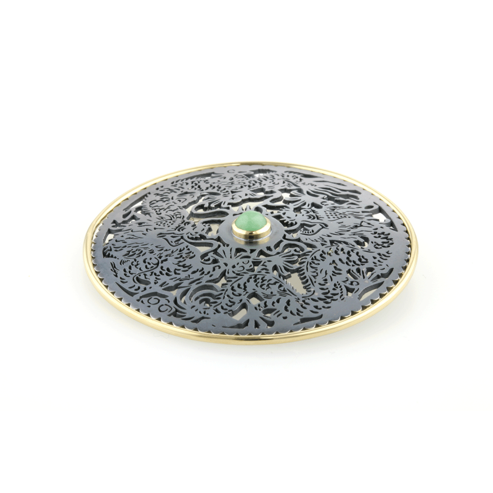 Silver Chinese brooch with a dragon design and 18ct yellow gold accents
