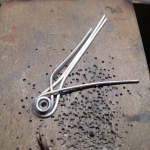 In the process of making a silver knot pendant